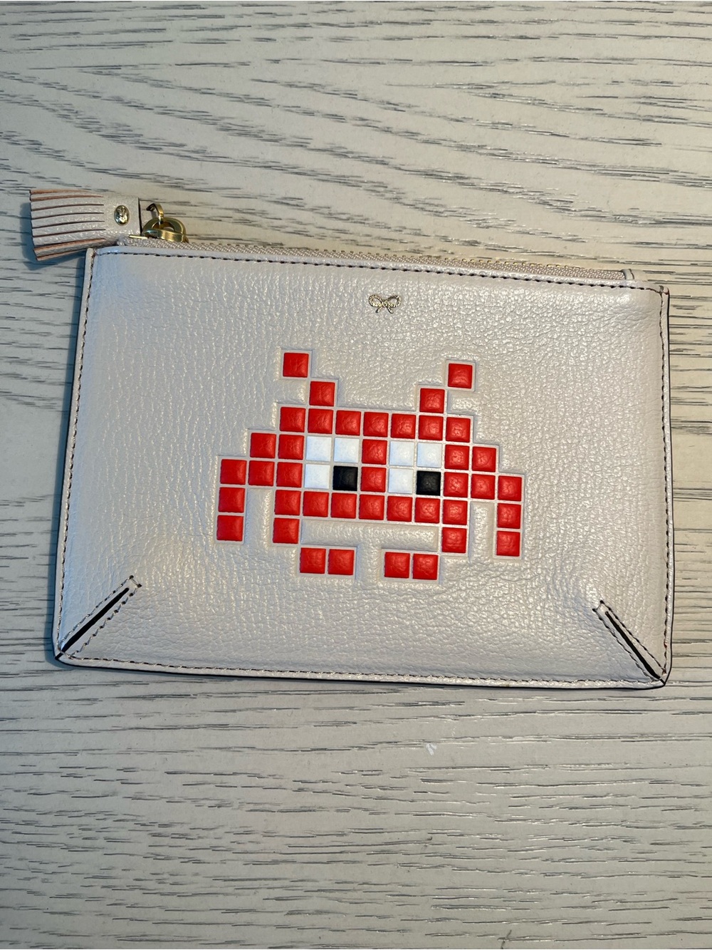 Anya Hindmarch Cream Leather Wristlet Clutch with Red Pixel Alien Motif